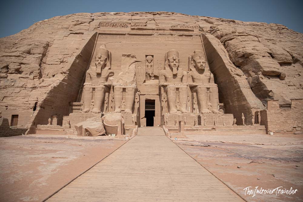 Facade of Abu Simbel temple, with four colossal seated statues of Ramesses II carved into the sandstone cliff