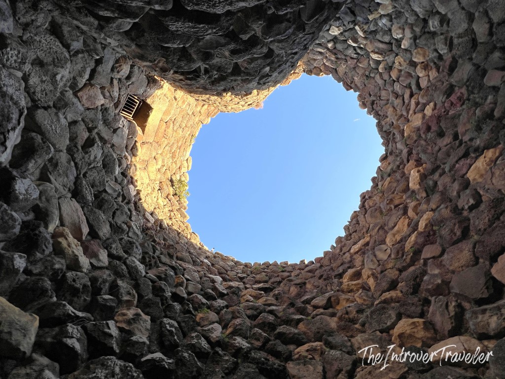 Looking up through the open top of a Nuraghe tower at Barumini, revealing its ancient corbelled stone interior