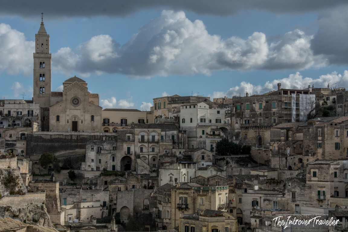Matera Sassi skyline with the Cathedral bell tower rising above ancient stone dwellings, Basilicata Italy
