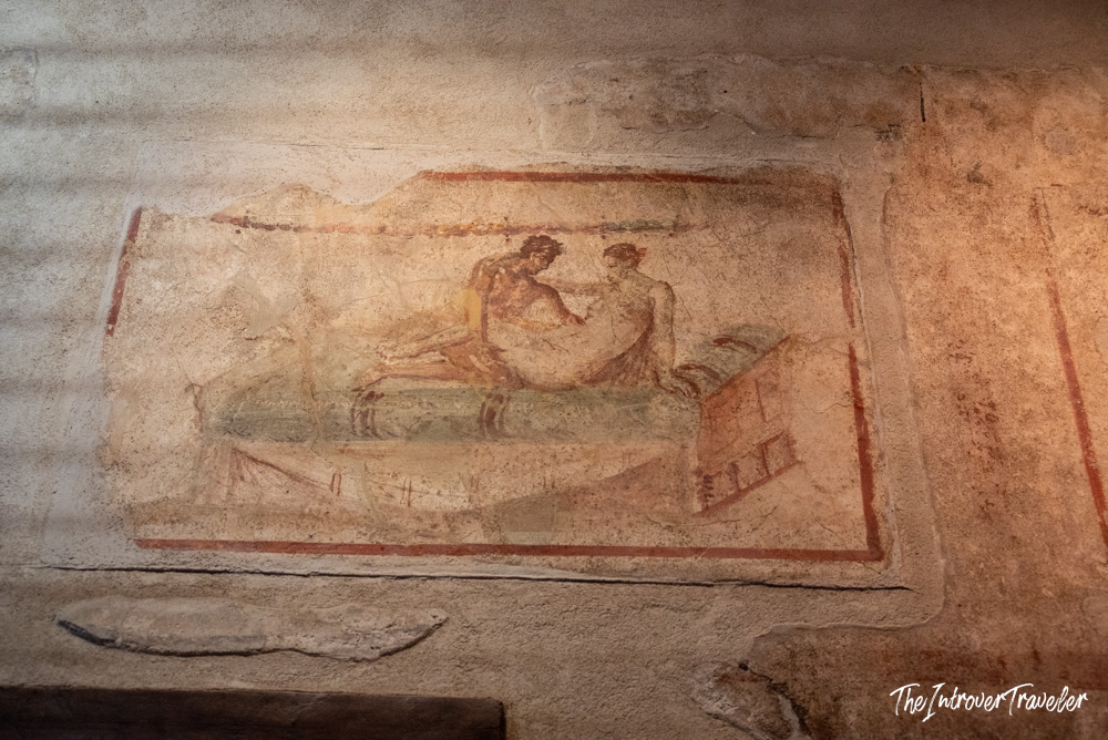 Erotic fresco on the wall of the Lupanare brothel in ancient Pompeii