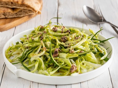 Puntarelle alla romana salad with anchovy dressing, a classic bitter chicory dish from Rome