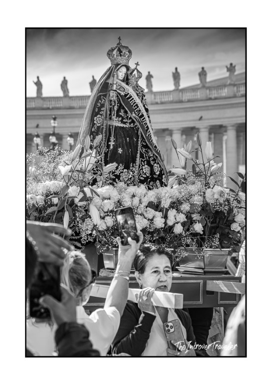 Virgen de los Dolores statue carried in procession at St. Peter's Square, Vatican, surrounded by flowers