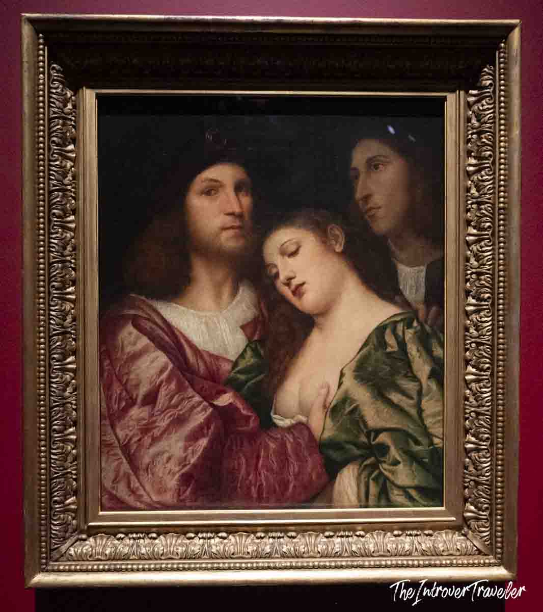 Venetian Renaissance painting of three figures by Titian, displayed at the Accademia Gallery in Venice