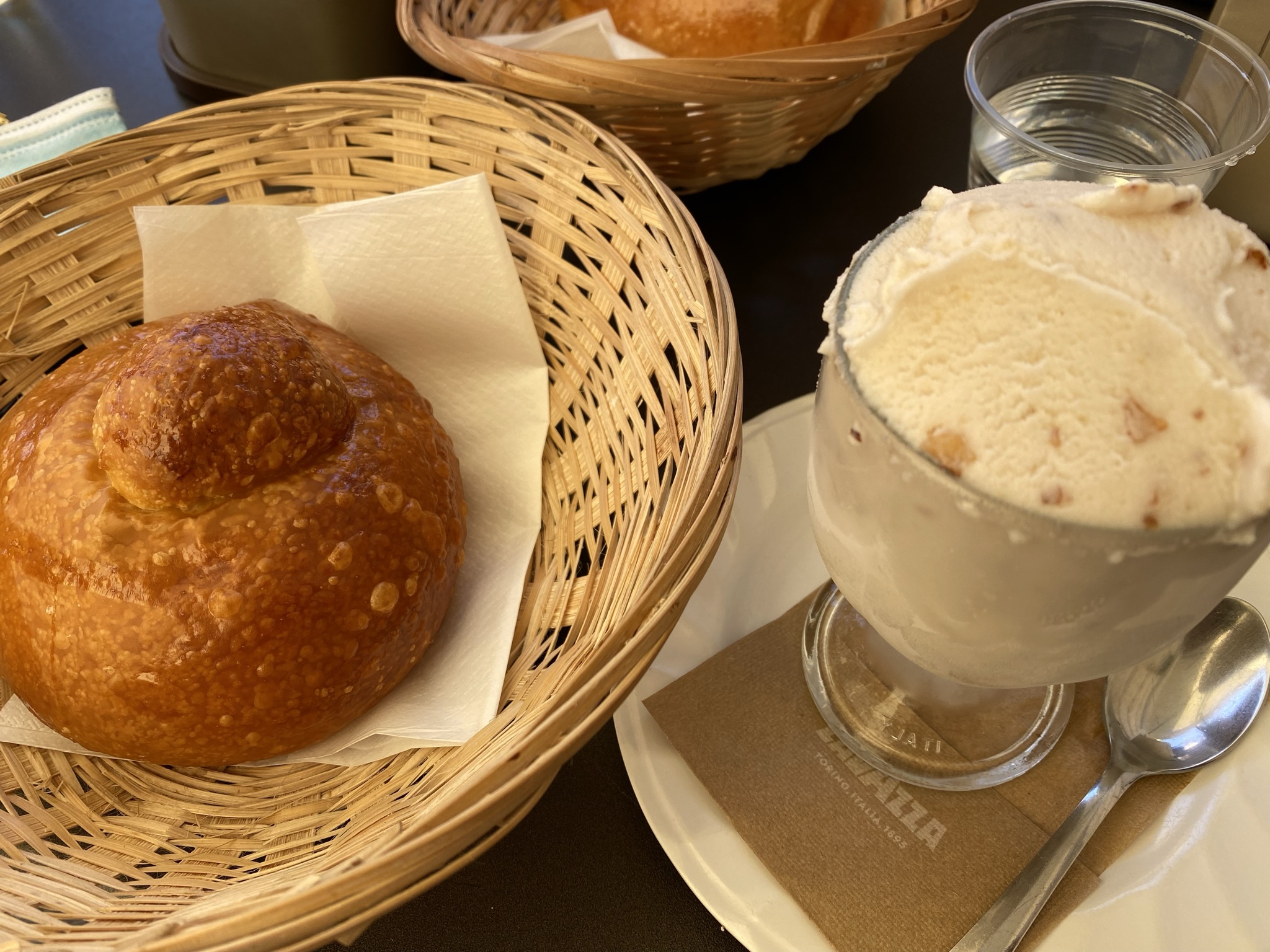 Sicilian granita with brioche col tuppo, a classic Catania breakfast served at a Lavazza cafe