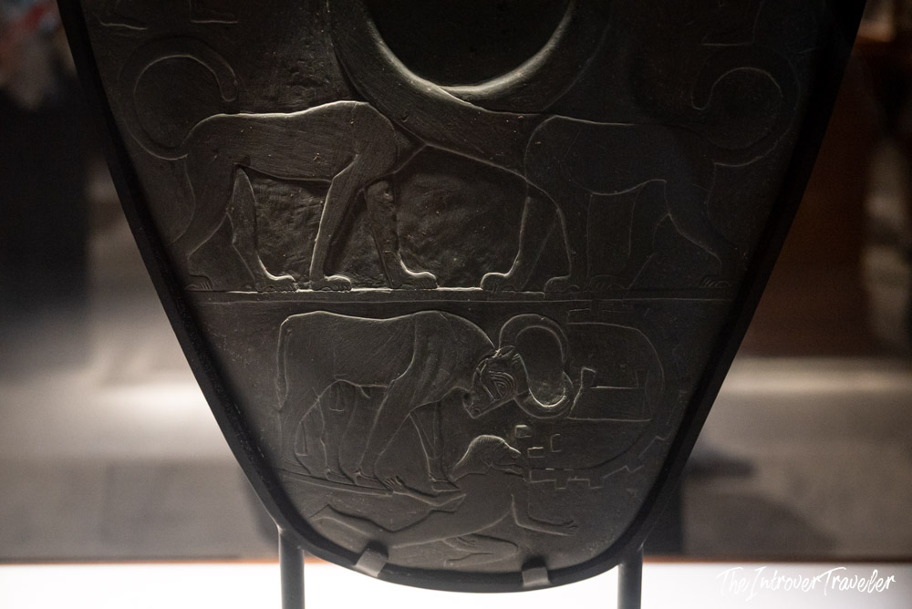 Close-up of carved animal reliefs on the Narmer Palette, ancient Egyptian artifact at the Cairo Museum