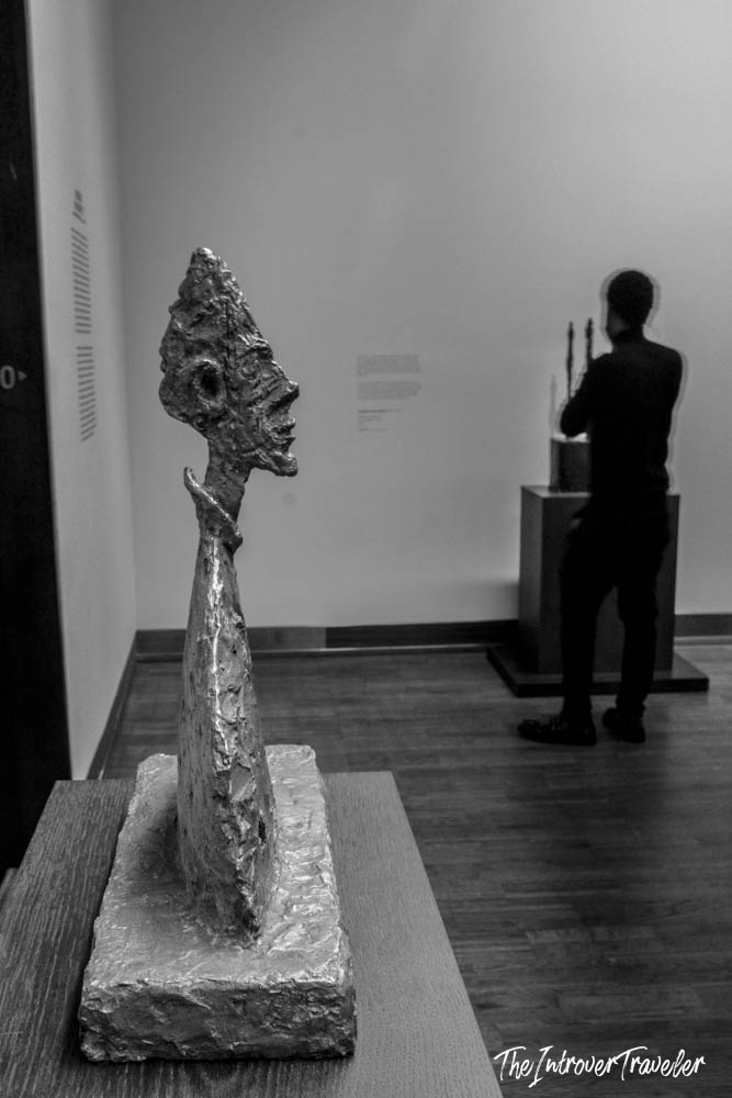 Giacometti-style elongated bronze head sculpture on display at the Albertina Modern, Vienna