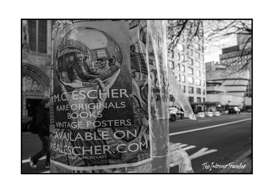 Street pole flyer advertising M.C. Escher rare originals near Central Park, New York