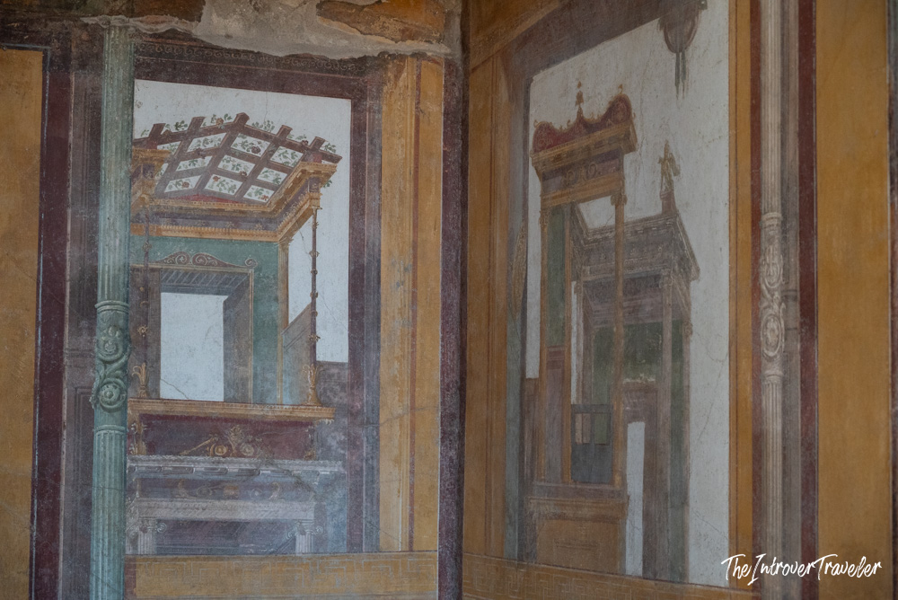 Second Style Roman wall frescoes with trompe l'oeil architecture in a Pompeii house