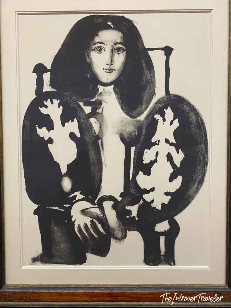 Black and white Picasso lithograph of a seated woman, on display at the Albertina Museum Vienna