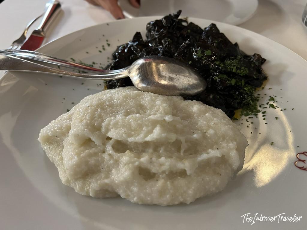 Seppie in nero with white polenta at Le Antiche Carampane, a classic Venetian lagoon dish