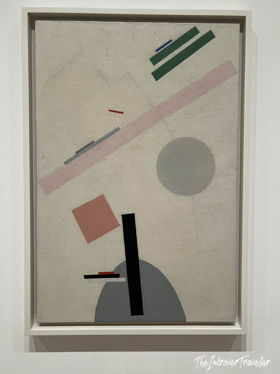 Constructivist abstract painting with geometric shapes displayed at MoMA, New York