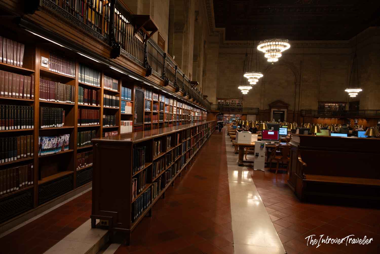 Rose Main Reading Room at the New York Public Library, with wood shelves, chandeliers, and reading tables