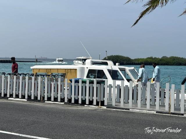 Maldives speedboat docked at a local jetty, ready to transfer divers between islands