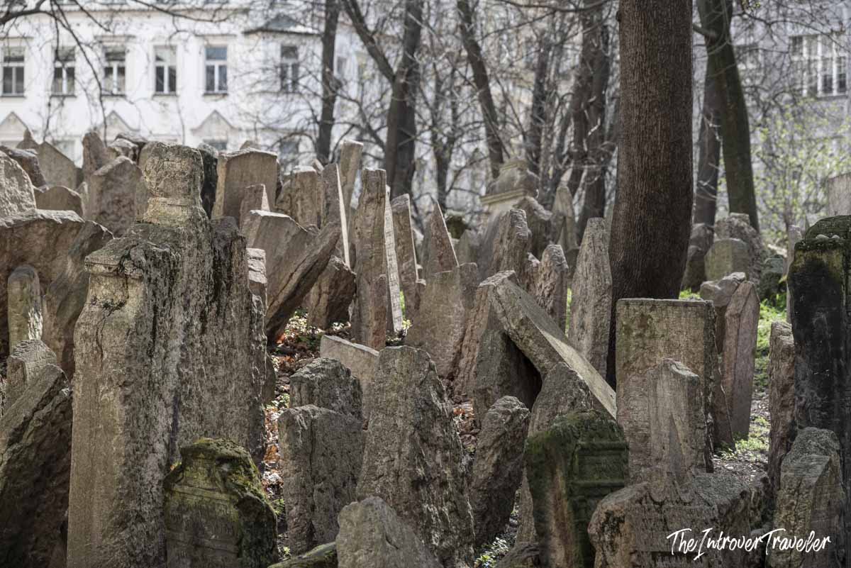 Densely packed ancient gravestones leaning at angles in the Old Jewish Cemetery, Prague