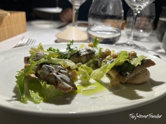 Grilled fish with chicory, chickpeas, and olive oil at L'Ebbrezza di Teonilla, Naples