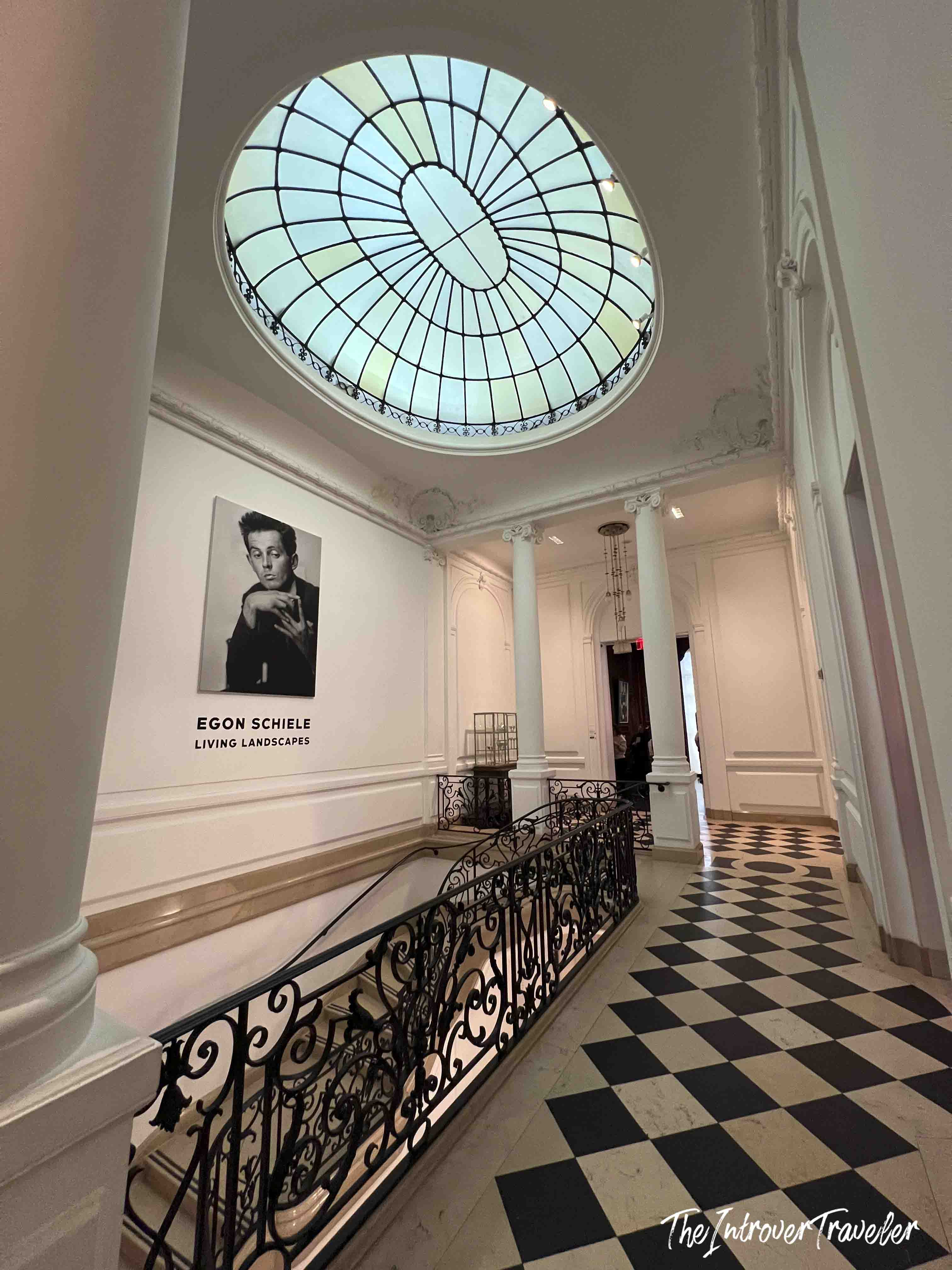 Neue Galerie New York entrance hall with Egon Schiele Living Landscapes exhibit, oval skylight, and checkered floor