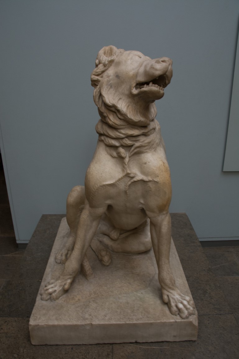 Ancient Roman marble dog sculpture with collar, on display at the British Museum in London