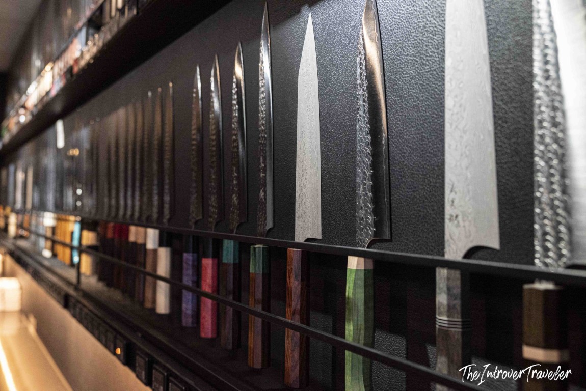 Wall display of traditional Japanese kitchen knives at a Tsukiji market shop, Tokyo