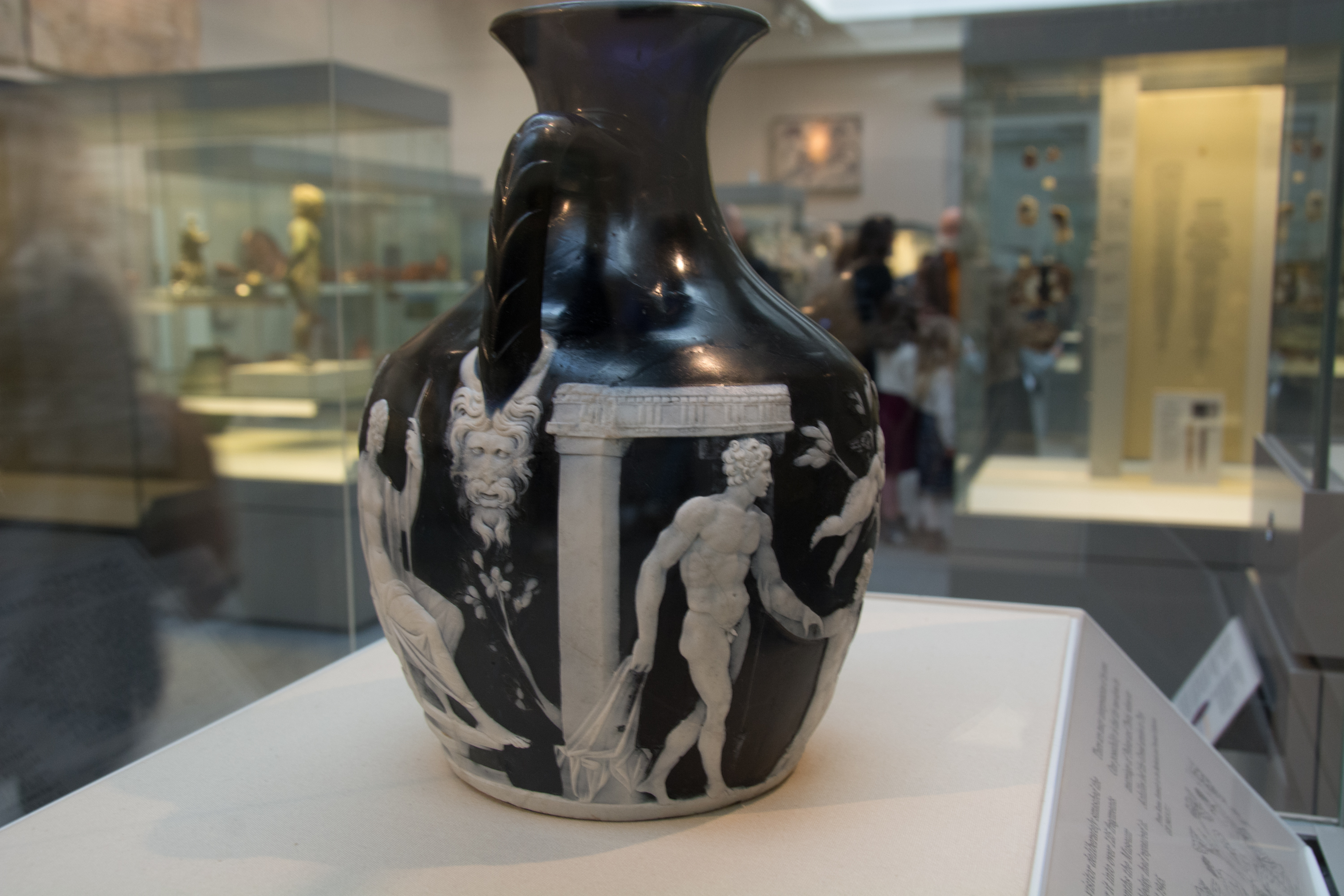 Black Wedgwood jasperware jug with white classical relief figures on display at the British Museum, London