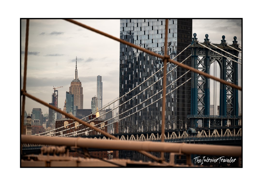 View from Brooklyn Bridge toward Manhattan Bridge tower and Empire State Building, NYC