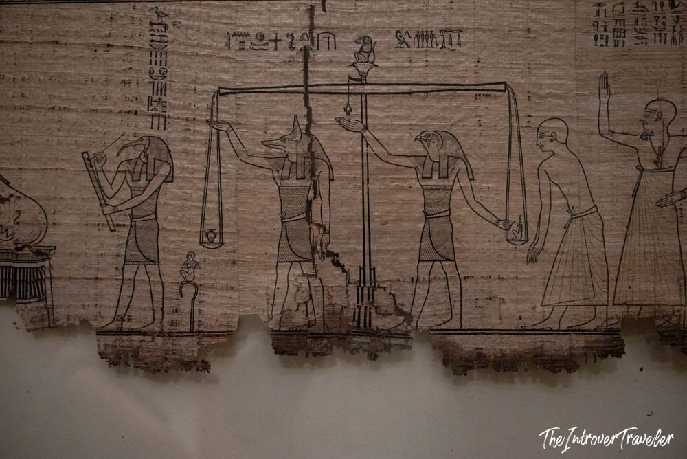 Ancient Egyptian papyrus scroll showing the Weighing of the Heart ceremony, Egyptian Museum Cairo