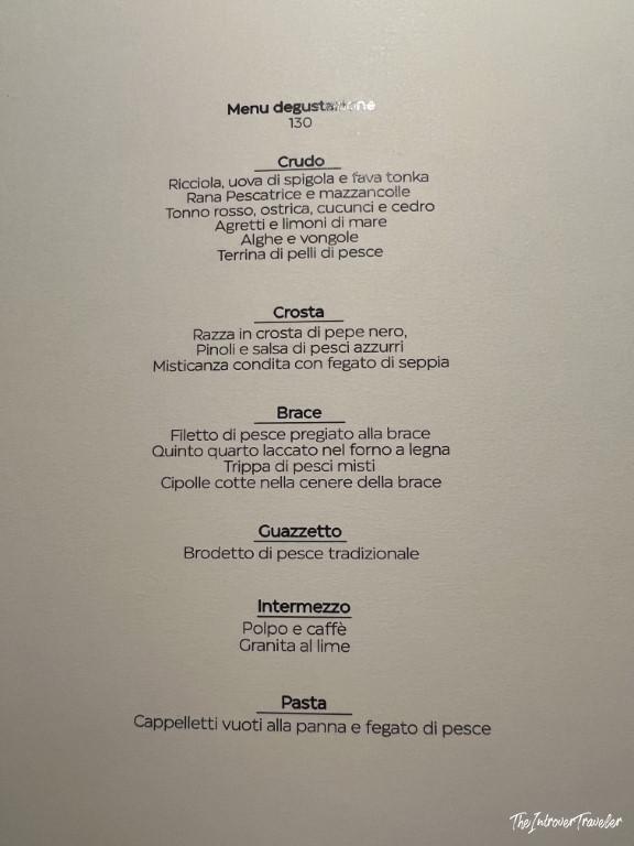 Tasting menu at Trattoria Da Lucio Rimini, showing seafood courses including Crudo, Crosta, Brace, and Pasta