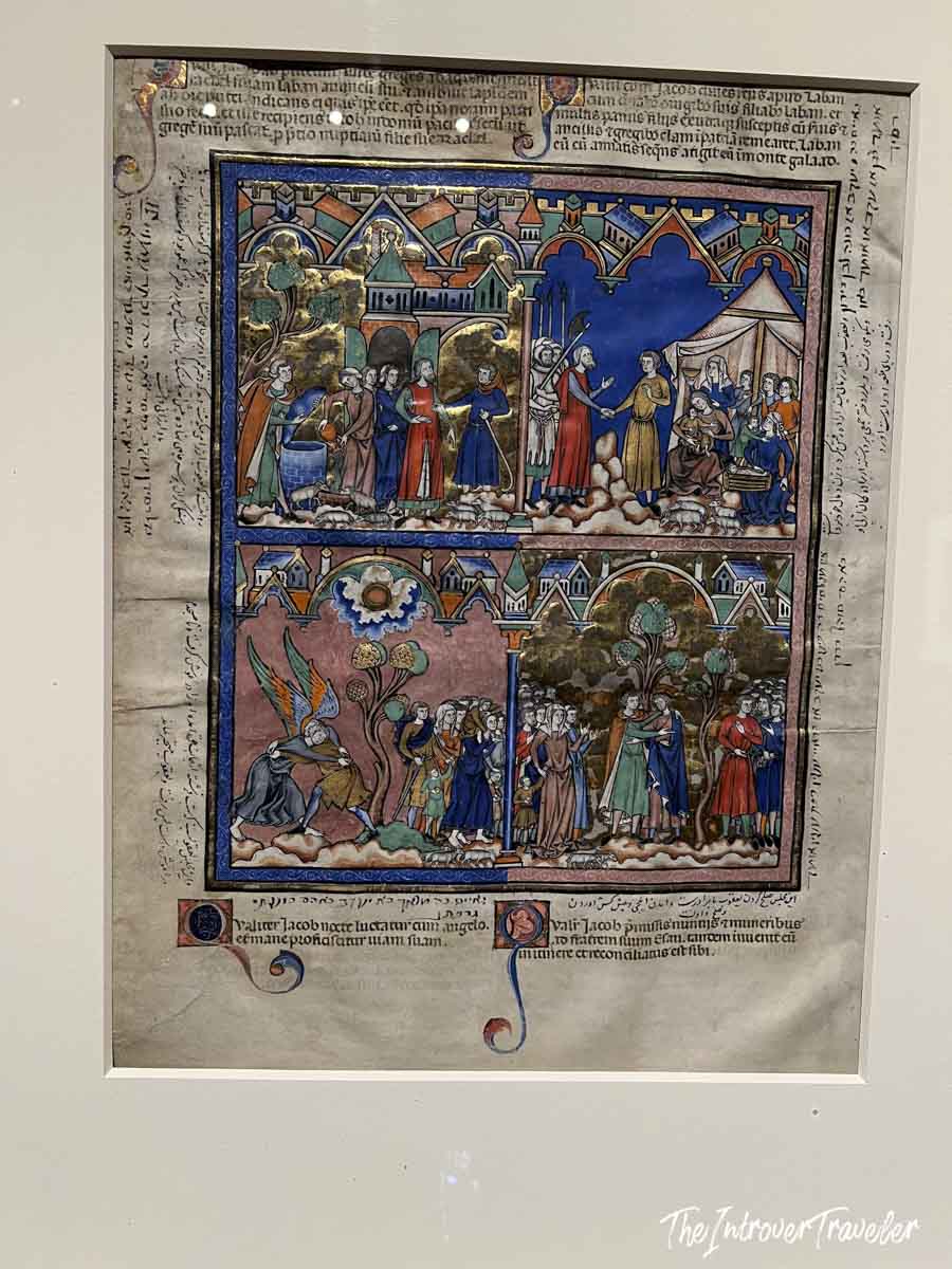 Illuminated medieval manuscript page with biblical scenes, displayed at the Morgan Library Museum New York
