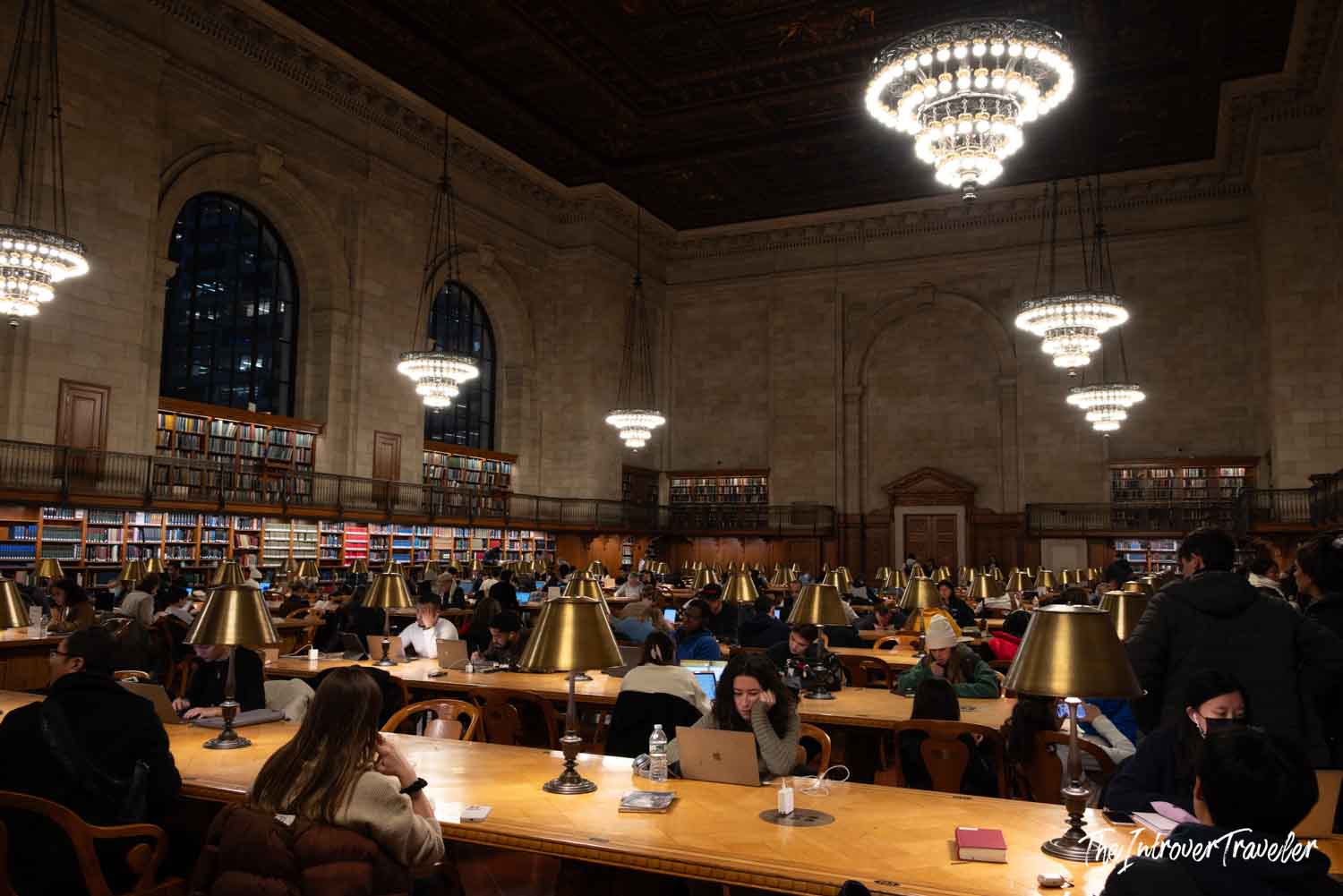 Rose Main Reading Room at the New York Public Library, filled with visitors studying under brass lamps