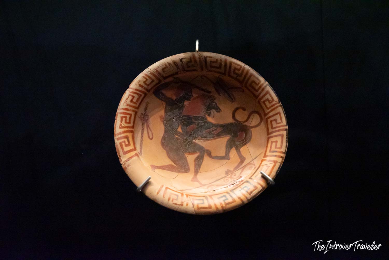 Ancient Greek black-figure ceramic plate with hero and lion scene, Istanbul Archaeological Museum
