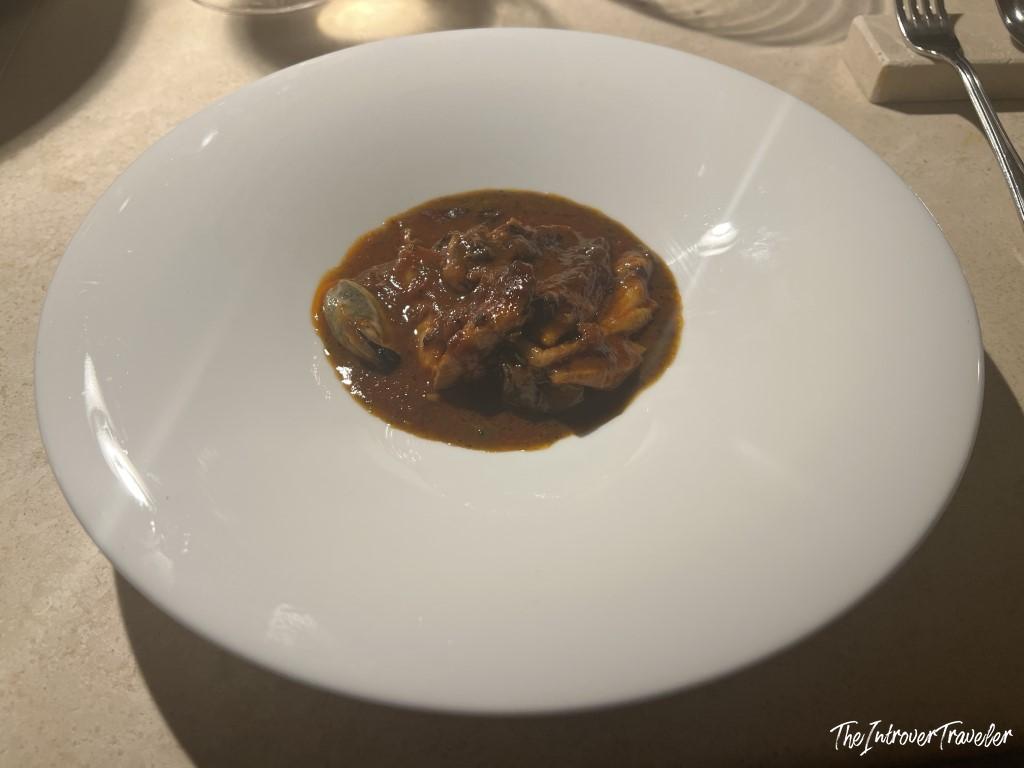 Seafood stew with mussels in rich tomato broth, served at Trattoria Da Lucio in Rimini