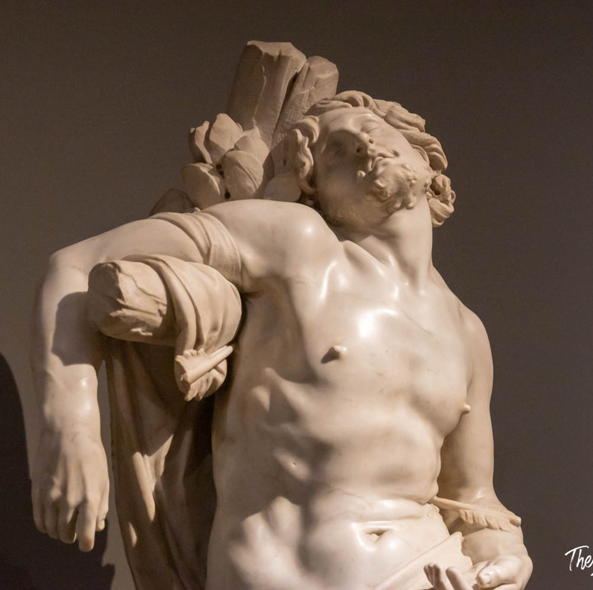 Bernini's Saint Sebastian marble sculpture, torso arched back with an arrow, displayed at Palazzo Barberini