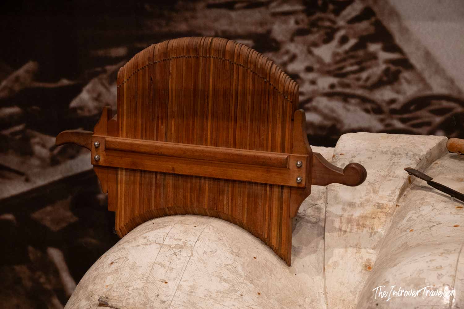Wooden profile template used to shape Statue of Liberty copper panels, resting on a plaster form