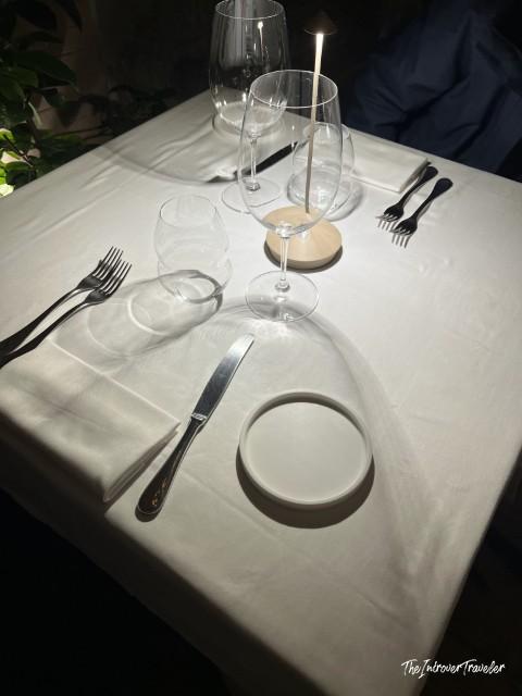 Elegant table setting at L'Ebbrezza di Teonilla, a fine dining restaurant in Naples, before service begins
