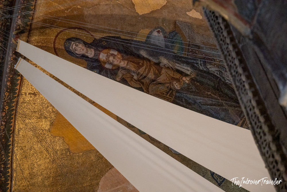 Byzantine Virgin and Child apse mosaic in Hagia Sophia, Istanbul, partially obscured by scaffolding