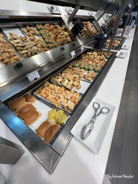 Buffet spread of savory pastries and rolls at the Leonardo Lounge, Milan Linate Airport