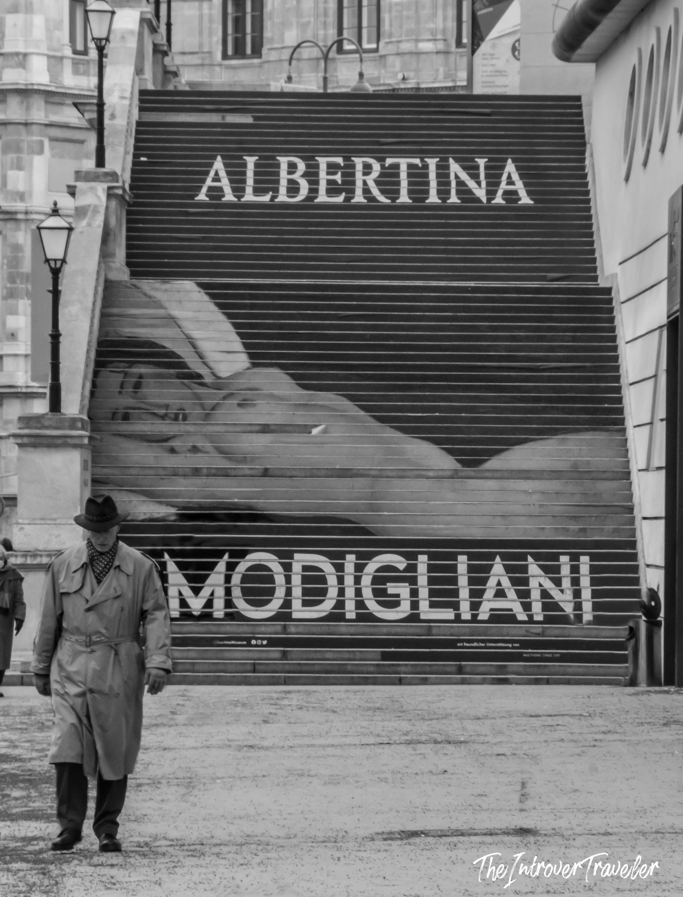 Albertina Museum Vienna entrance stairs with a Modigliani exhibition banner in black and white