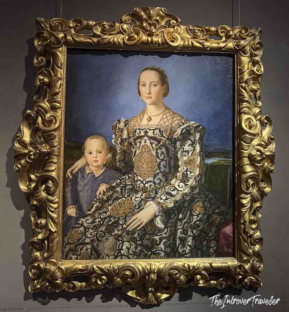 Bronzino's Eleanor of Toledo with her Son Giovanni, displayed in an ornate gilded frame at the Uffizi Gallery Florence