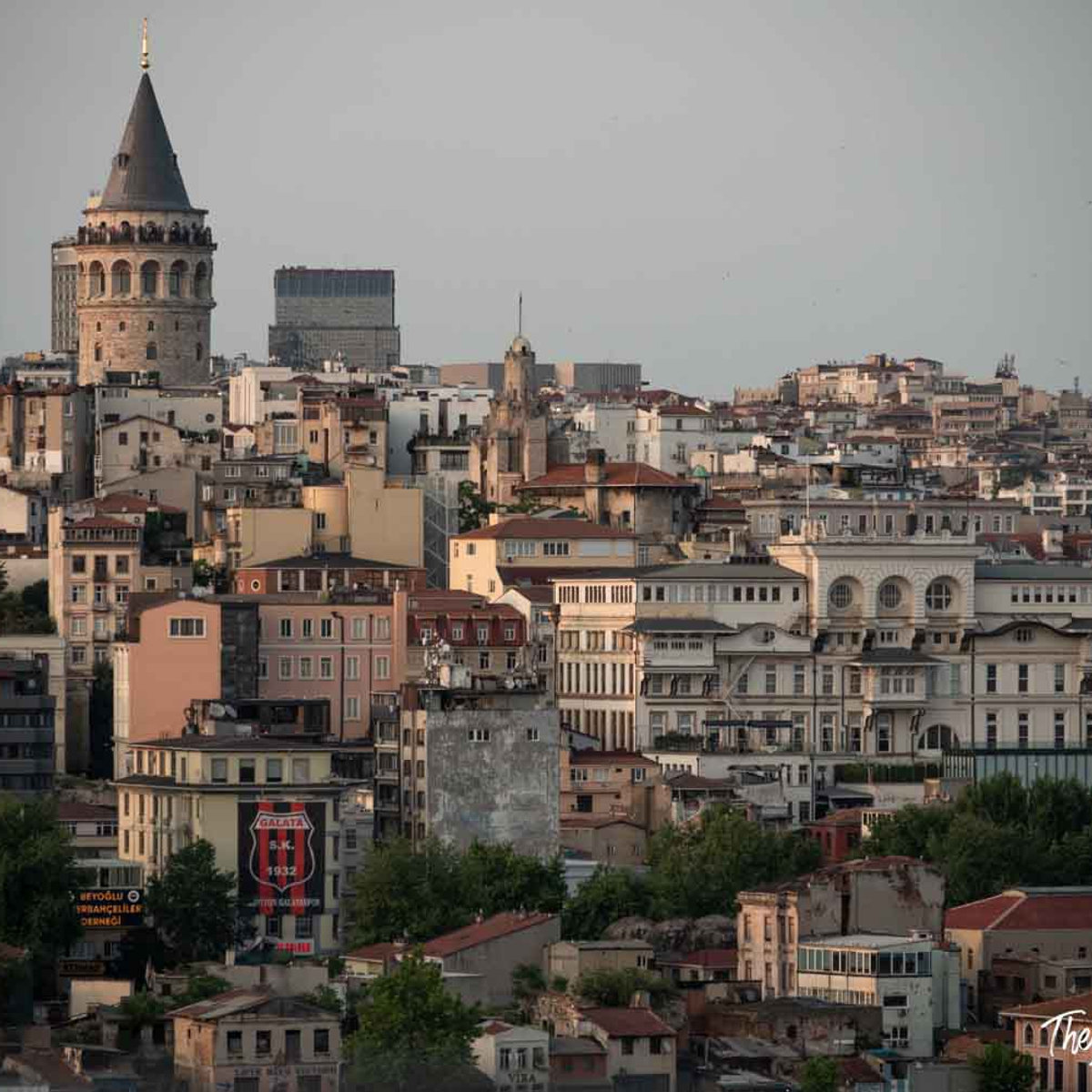 Galata Tower rising above the dense Beyoglu district skyline in Istanbul