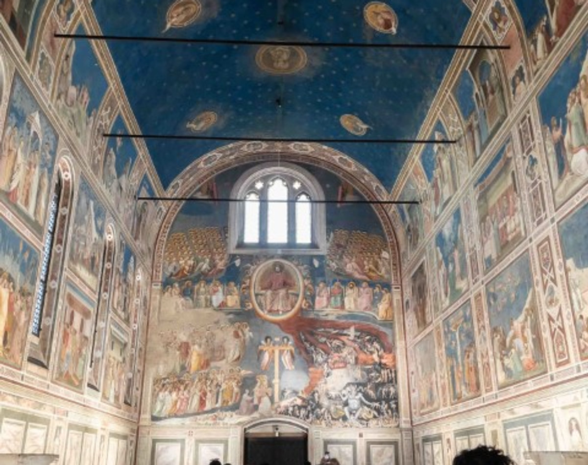 Interior of the Scrovegni Chapel, Padua, showing Giotto's Last Judgment fresco and star-filled blue ceiling