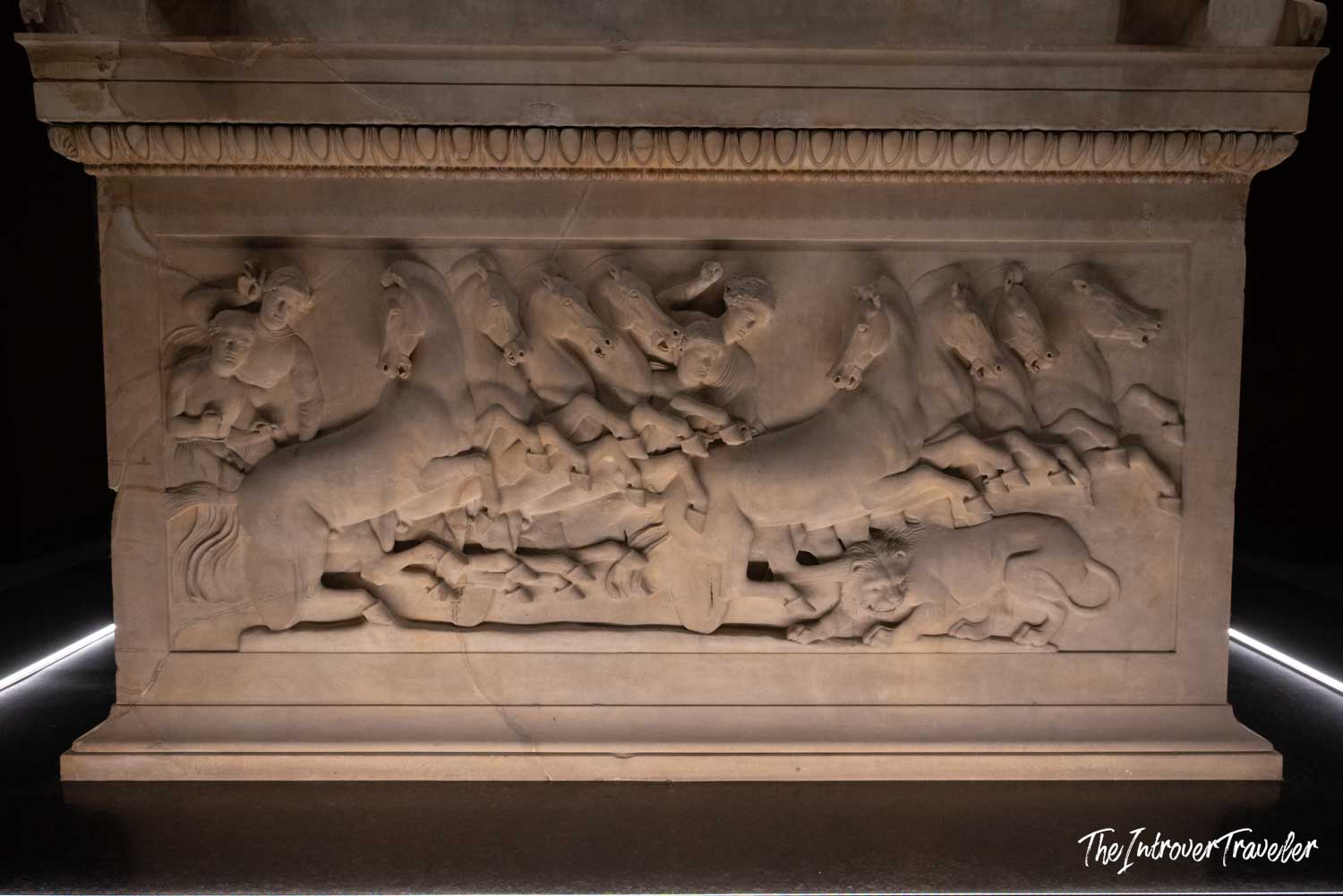 Ancient marble sarcophagus relief showing a hunt scene with horses and warriors, Istanbul Archaeological Museum