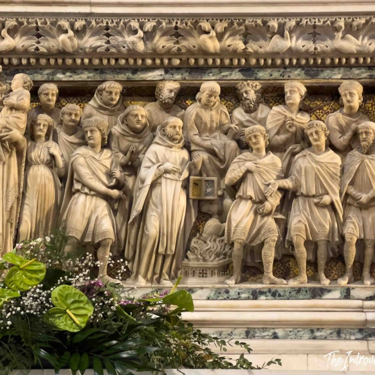 Marble relief panel on the Ark of Saint Dominic, Bologna, depicting robed figures in a narrative scene