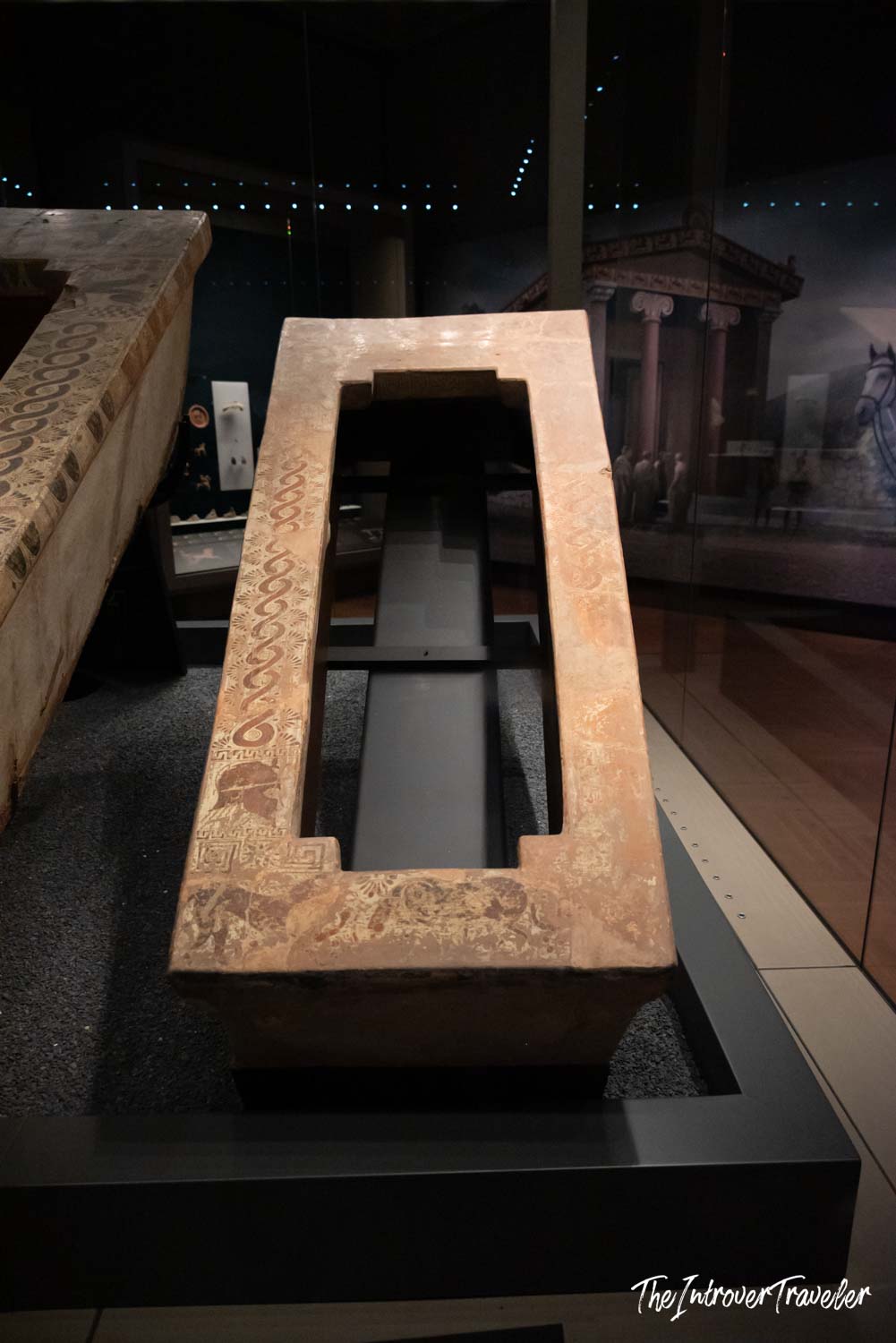 Ancient carved terracotta sarcophagus lid with engraved figures, on display at the Istanbul Archaeological Museum