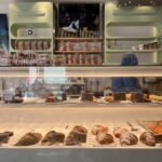 Glass display case at Dudu Bakery Istanbul, filled with croissants and pastries on the counter