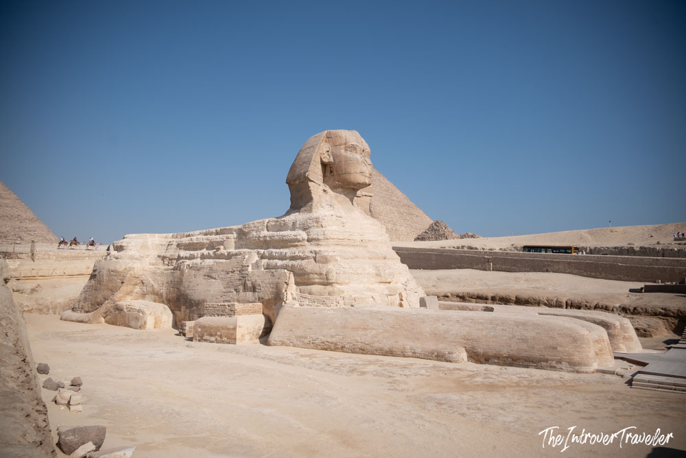 Great Sphinx of Giza viewed from the side, with the Pyramid of Khafre rising behind it