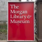Red entrance sign for The Morgan Library & Museum in New York, photographed in December 2024