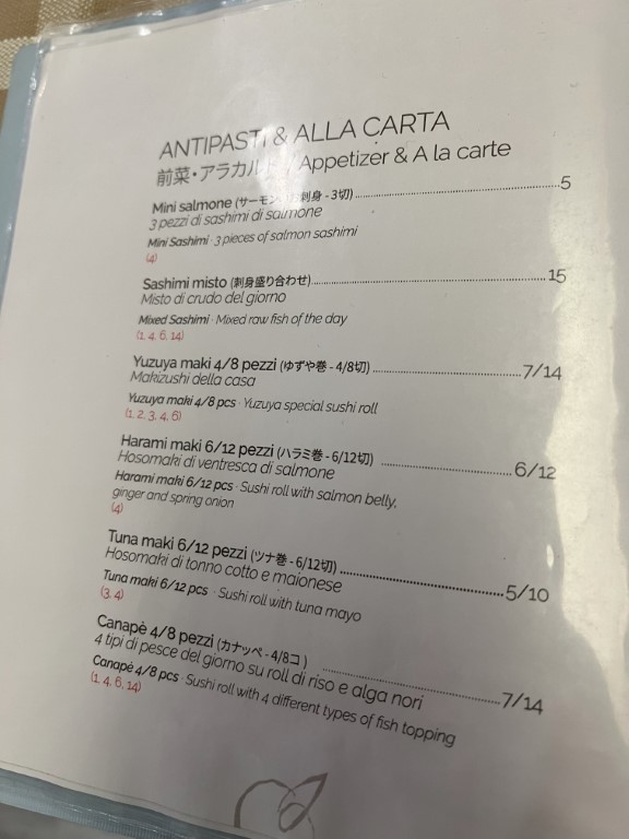 Yuzuya Bologna appetizer menu featuring salmon sashimi, maki rolls, and a la carte Japanese dishes