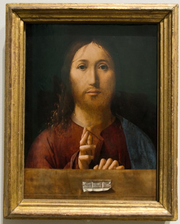 Salvator Mundi style painting of Christ blessing, displayed in a gilded frame at the National Gallery London