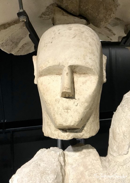 Ancient stone head of a Giant of Mont'e Prama, displayed at a Cagliari museum