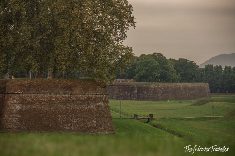 Lucca's Renaissance city walls with a bastion and green moat, Tuscany, Italy