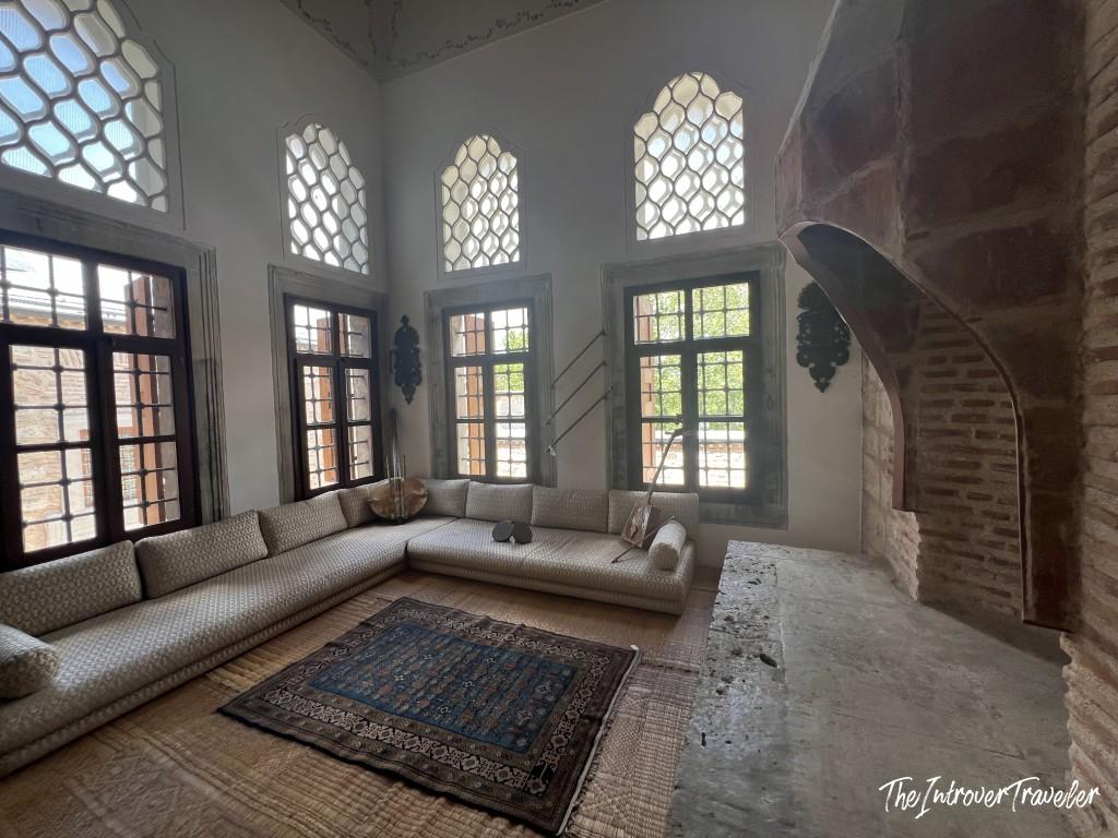 Interior of the Topkapi Palace Harem, Istanbul, with latticed windows and low Ottoman seating